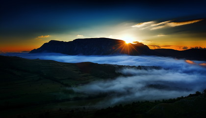 beautiful mountain landscape in foggy morning in Alba, Romania