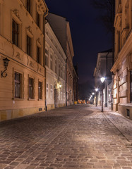 Fototapeta na wymiar Golebia street in university quarter, Krakow, Poland, in the night