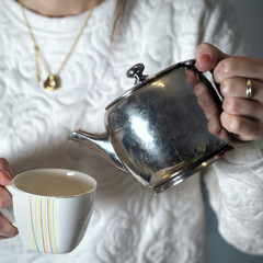 Woman Pouring Tea