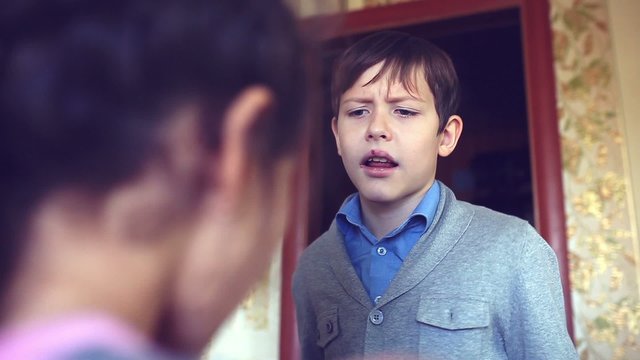 boy and girl teens shout swear dispute evil family conflict