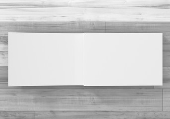 Magazin Doppelseite offen auf Holz