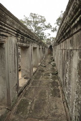 Fototapeta na wymiar Ancient walls at Angkor Wat complex, Cambodia.