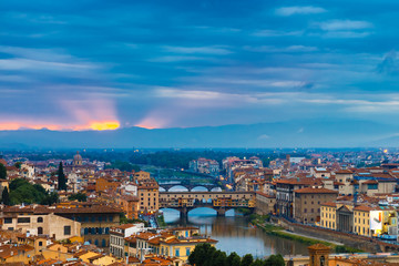 Fototapeta na wymiar Arno and Ponte Vecchio at sunset, Florence, Italy