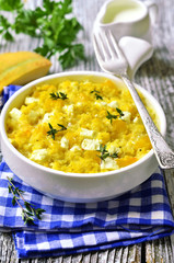 Spicy millet casserole with pumpkin and feta.