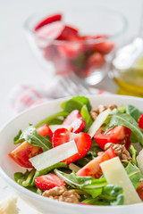 Strawberry salad in white bowl
