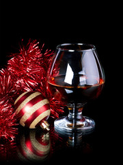 Striped New Year's ball, tinsel and glass.