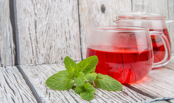 Hot hibiscus tea with fresh mint leaves