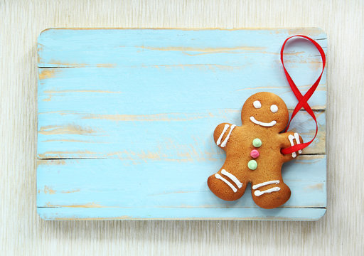 Image of Gingerbread man on blue vintage cutting board