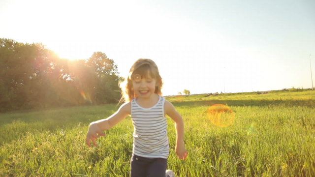 Girl running in field with smile