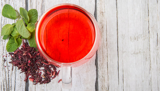 Hot hibiscus tea with fresh mint leaves