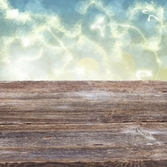 wooden planks with golden bokeh background
