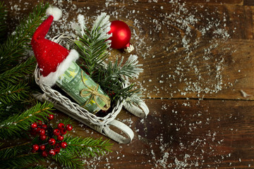 Gift money with red ribbon and Santa cap