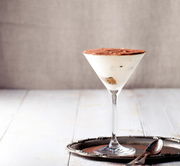 Tiramisu dessert in a glass. Traditional Italian.