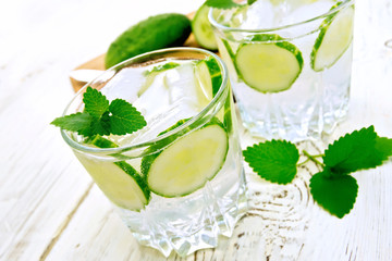 Lemonade with cucumber and mint on white board