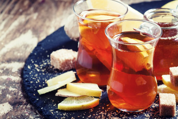 Black hot tea with honey, lemon and cane brown sugar in Middle E