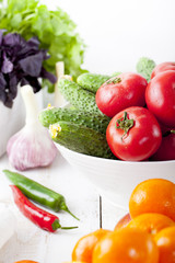 Fresh fruits, vegetables and herbs variety Wooden background