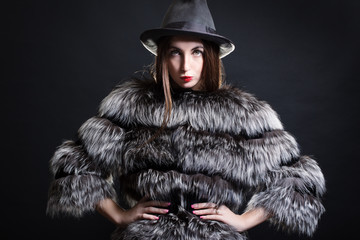 Fashion woman in fur coat