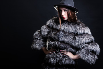 Fashion woman in fur coat