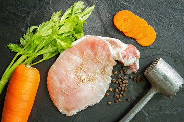 Fresh pork meat with pepper, rosemary, carrot, celery  and meat