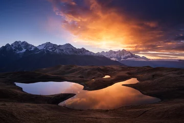 Tuinposter Beautiful sunrise in mountains near lake © Oleksandr Kotenko