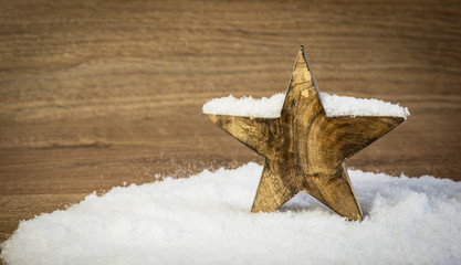 Wooden Christmas Star in Snow with Ski
