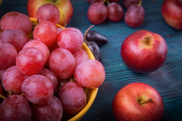 Close up of bunch of grapes and apples