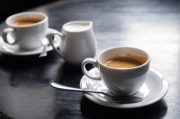 two coffee cups on table in cafe