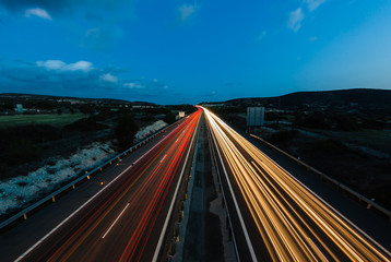 Fototapeta na wymiar Night highway. Lights of moving cars. Cyprus