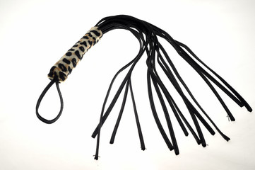 Black whip - sex toy isolated on white background
