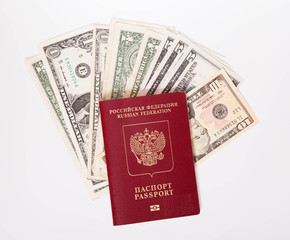 The Russian passport lies on a pile of notes (dollars)