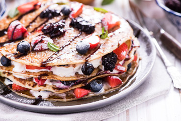 Fresh crepes with fruits and chocolate