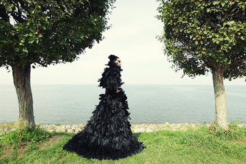 Fashion woman posing near the sea. 