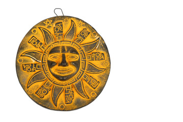 Mexican yellow ceramic sun souvenir isolated on white