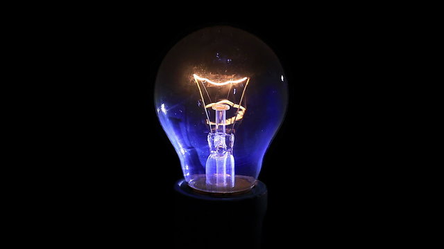 Light bulb on black background