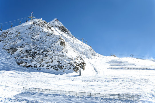 Ski lifts and snow fences in Austrian Alps