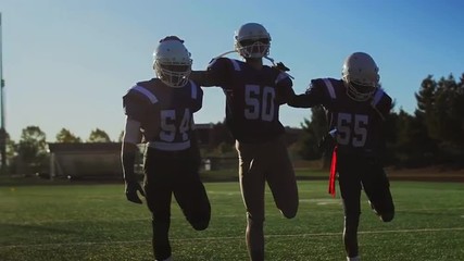 Football players stretching before a game
 - Powered by Adobe