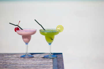 Two tasty cocktails on tropical white beach