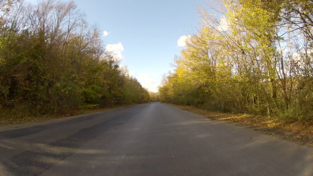 winding road  through countryside in early autumn, video with GoPro