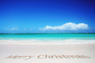Fototapeta na wymiar Tropical beach and merry christmas text