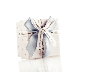 Gift box with ribbon isolated on a white background