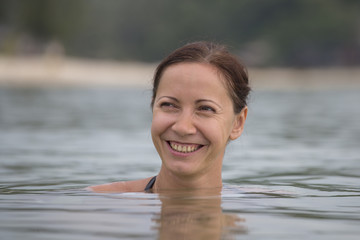 Beautiful happy woman in sea water