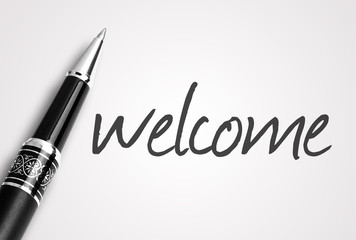 pen writes welcome on white blank paper - 95426329