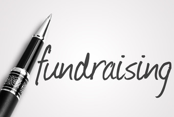 pen writes fundraising  on white blank paper - 95426953