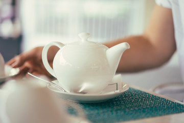 White teapot in the restaurant