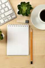 Fototapeta na wymiar White keyboard and notebook on the desk