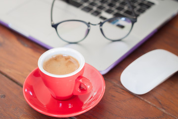 Red coffee cup on work station