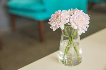 Flowers in a Glass at Restaurant