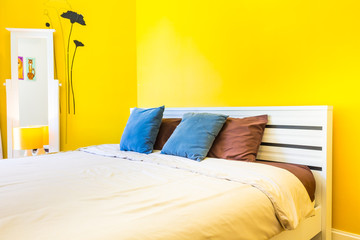 Interior Design: Modern Bedroom, Bedside cabinet. / Interior Design: Modern Bedroom, White Wooden bedside table and reading lamp.