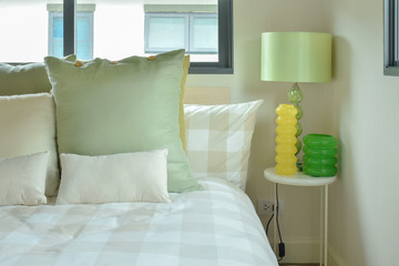 Green table lamp with green color scheme bedding