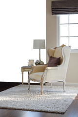 classic chair with brown pillow on carpet in vintage style inter